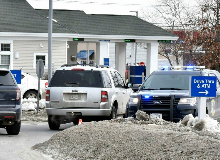 Three police vehicles block the entrance to the Bangor Savings Bank on Waterville Commons Drive on Feb. 12 after a robbery there. The robbery suspect, Jason Mackenrodt, 37, was sentenced Thursday to five years in prison for the crime.