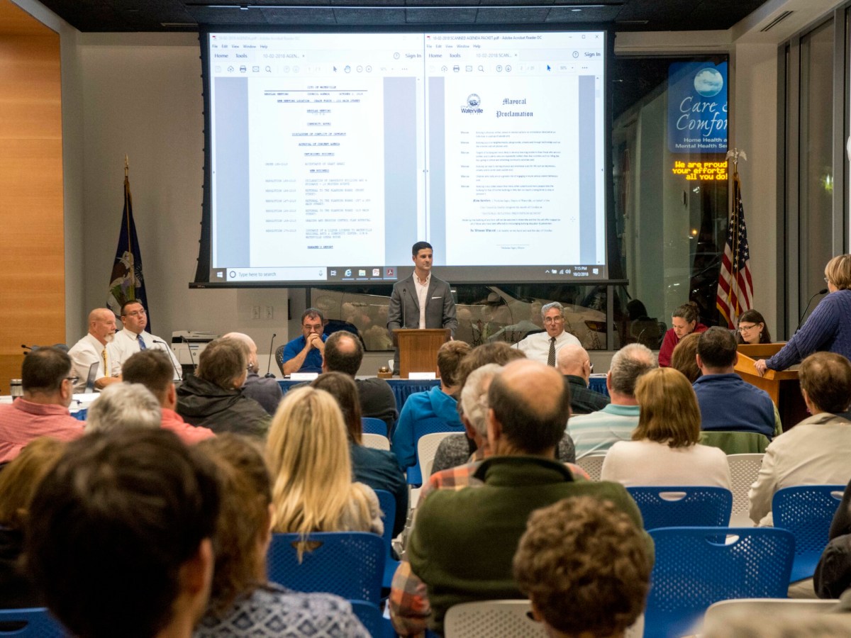 Waterville Mayor Nick Isgro, center, sits with city councilors in the Chace Community Forum, in the new Colby dorm downtown, on Oct. 2, 2018.