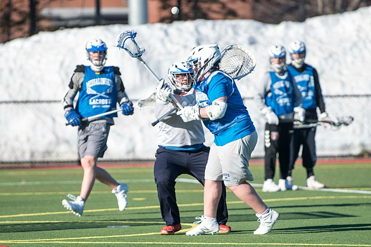 Members of the Messalonskee boys lacrosse team practice last week at Thomas College in Waterville.