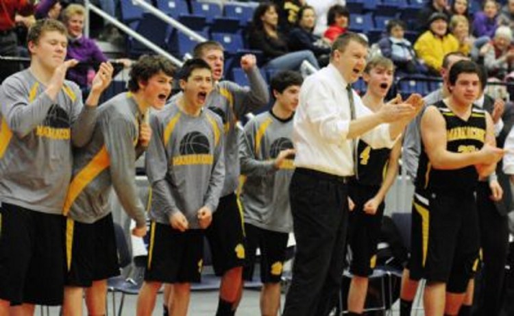 Maranacook coach Rob Schmidt cheers as the clock runs down during a Western C semifinal game against Winthrop in 2015. Schmidt stepped down as coach.