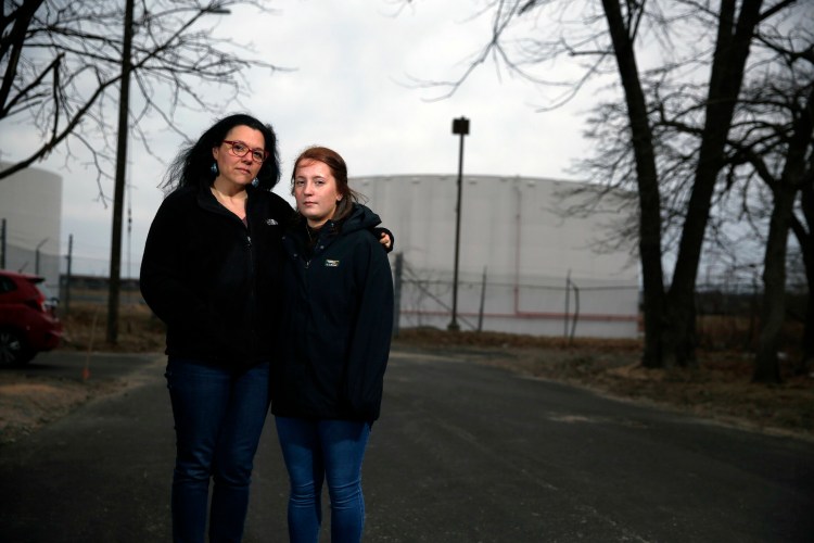 Kate Adamy, left, and her stepdaughter Ava Gleason live on Elm Street in South Portland's Pleasantdale neighborhood, where petroleum odors are worrying residents.