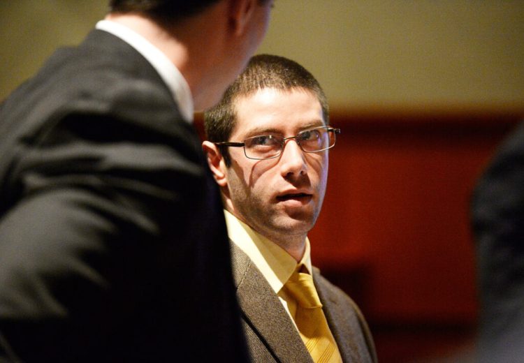 John D. Williams listens to attorney Patrick Nickerson in February while in court for a motion to suppress his confession in the death of Cpl. Eugene Cole, a sheriff's deputy from Somerset County who was fatally shot last year. 