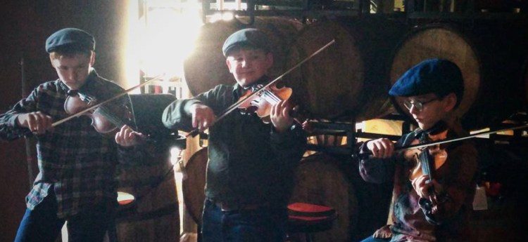 The Pineland Fiddlers Trio from left are Elijah Huttman, Owen Kennedy and Alden Gilg.