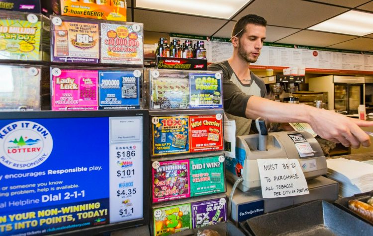 Lottery tickets are displayed at the counter at Anania's in Portland in 2016. The display advises people to play responsibly, but mental health advocates say the state doesn't have adequate resources to deal with problem gambling.