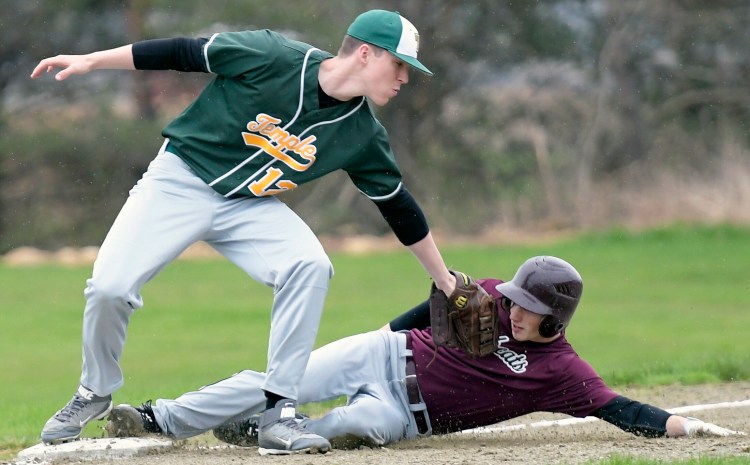 Richmond baserunner Dakotah Gilpatrick slides under the tag of Temple third baseman Nick Blaisdell during a Class D South game Tuesday in Richmond.