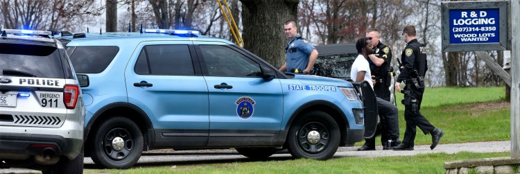 Tyrone Fleurimont, 31, of Roslindale, Massachusetts, is surrounded by police Wednesday after being apprehended at the Four Paws Only business on River Road in Benton.