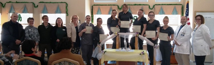 Northern Light Health. From left are Ray Potvin, Patti Saarinen, Myles Robert; Cathy Stairs, Western Maine Community Action; Robin Doody, Northern Light Continuing Care Lakewood; CNA graduates Anthony McCutcheon, Christy McCarthy, Julie Frost, Joselyn Marston, Brittany Horton, Kayla Hayden and Makayla Busque; Christopher Miller, and Patty Shuck, NLCCL.