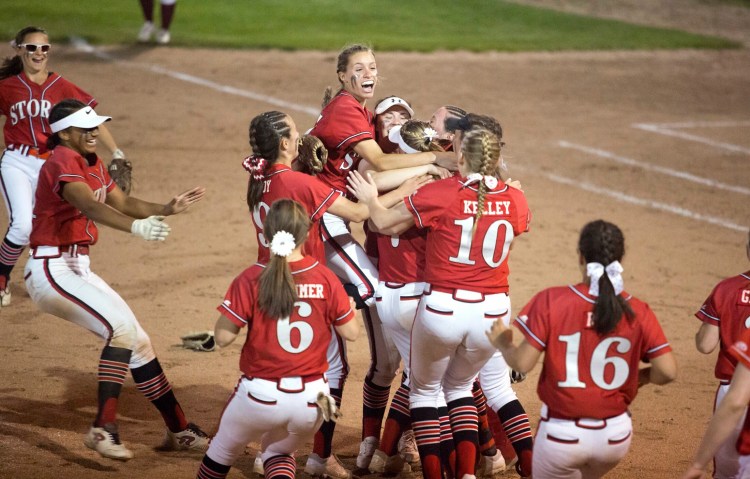 Scarborough players celebrate winning their third consecutive Class A South championship, 2019.