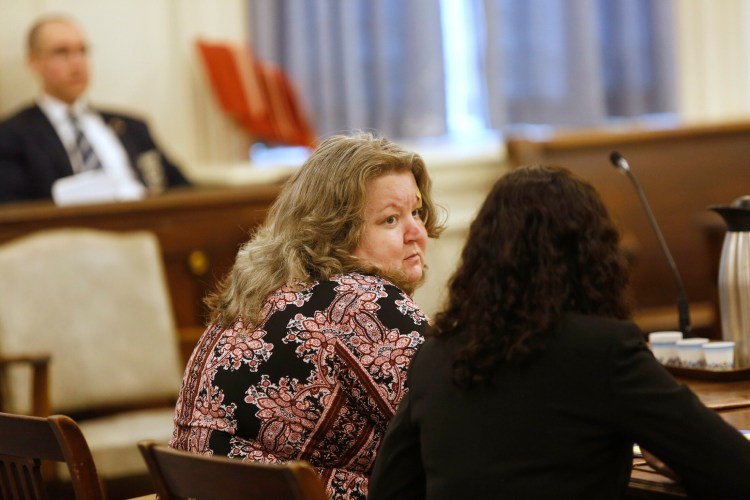 Kandee Weyland Collind looks toward her attorney, Molly Butler Bailey, during a court appearance in June to ask a judge to withdraw her guilty plea to the charge that she murdered her ex-husband. 