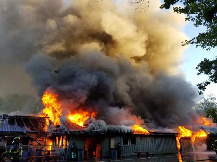 Firefighters battle the blaze Tuesday night at Bayley's Camping Resort in Scaborough.