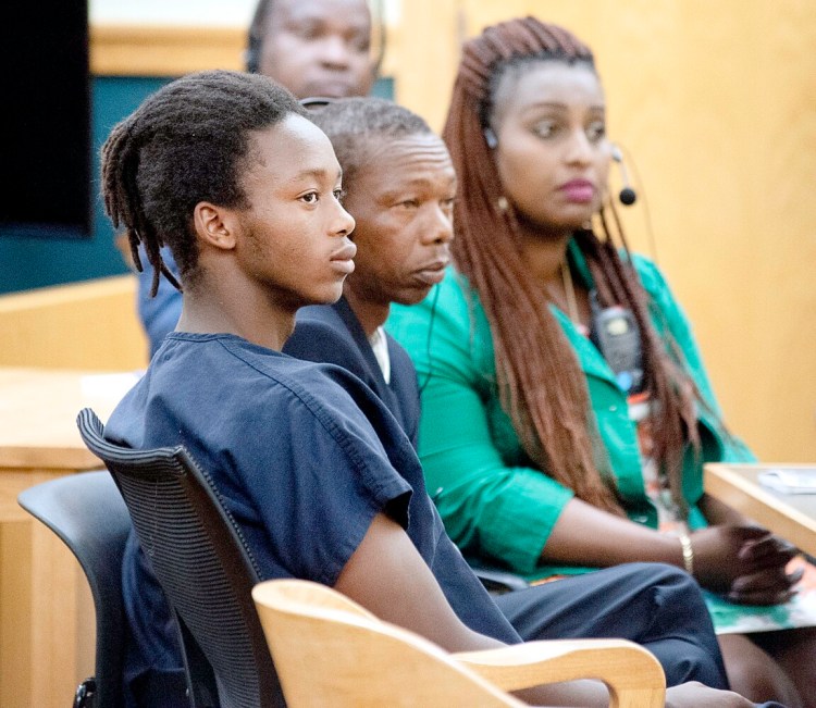 Emmanuel Nkurunziza, left, appears Monday in 8th District Court in Lewiston.