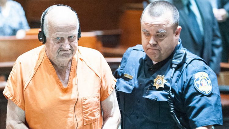 Albert Flick is led out of the courtroom after his July 2018 appearance in the Androscoggin County Courthouse in Auburn.