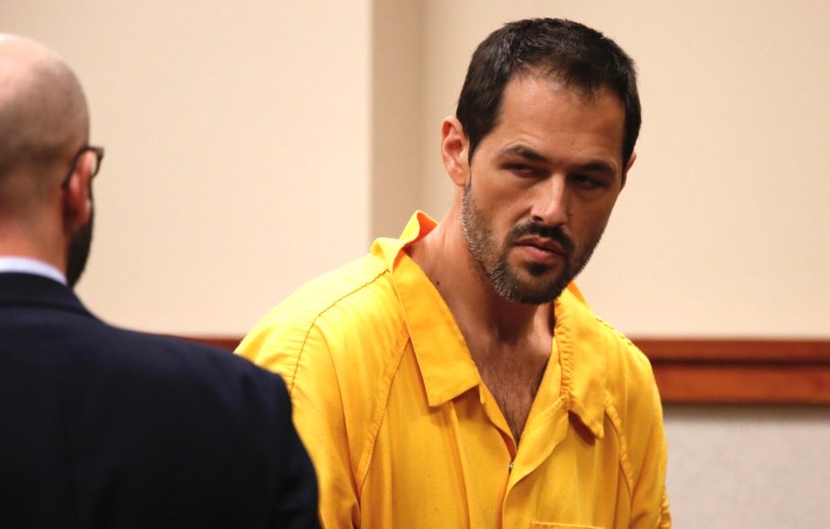 Michael Holden, 37, appears Friday at the Cumberland County Courthouse alongside attorney Stephen Shea. Holden, accused of attacking Margaret and Robert Macdonald on Wednesday at their home in Bridgton, was ordered held on $250,000 bail. 