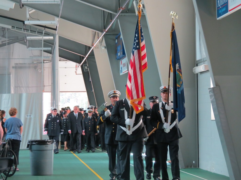 A Fairfield Fire Department color guard opens Capt. Jim Lane's celebration of life service Sunday at Thomas College in Waterville.