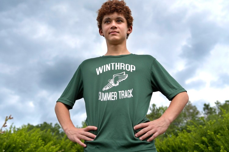 James Cognata poses by the track at the Winthrop Grade School on Monday. Cognata had an impressive showing at the USATF Maine Youth Development Summer Series state championship meet last weekend in Brewer.