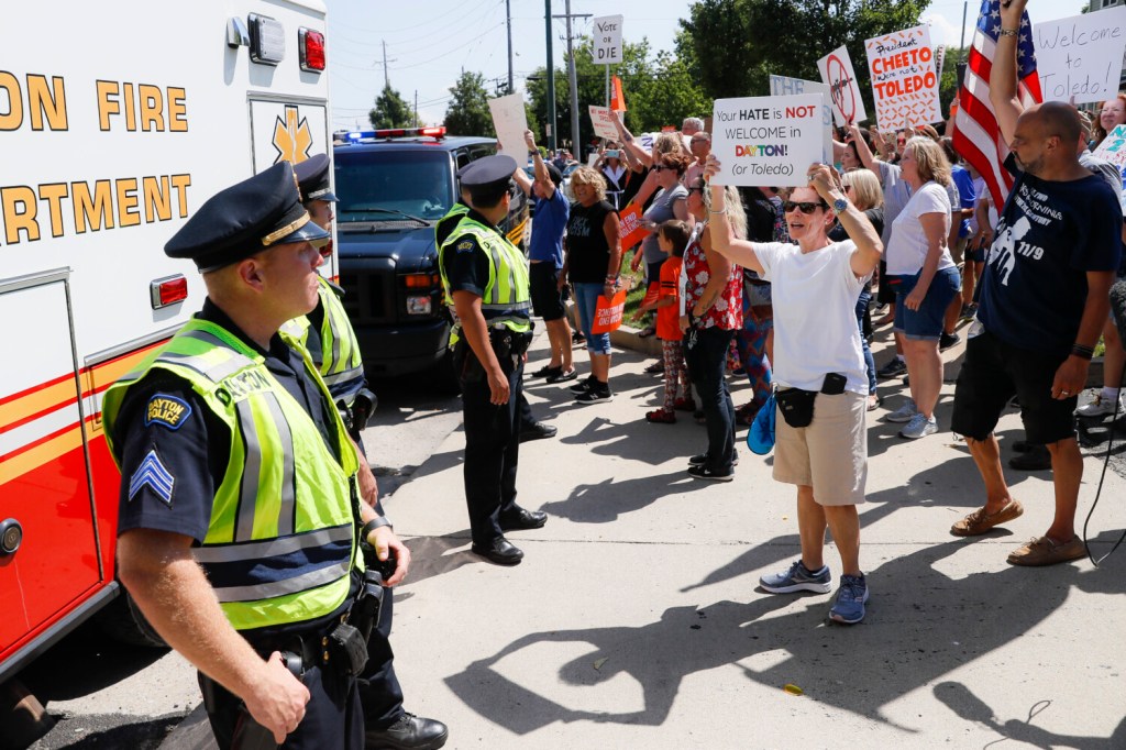 Demonstrators chant as they protest the arrival of President Trump on Wednesday outside Miami Valley Hospital after a mass shooting that occurred Sunday in Dayton, Ohio.