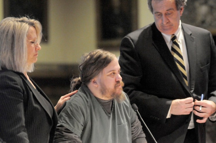 Eric Bard, formerly of Sidney, is flanked by his lawyers during a hearing Jan. 5, 2015, at Kennebec County Superior Court in Augusta.