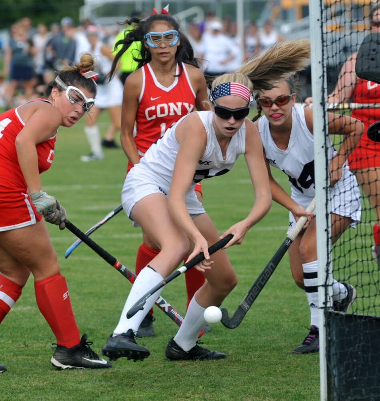 Skowhegan senior Emiky Reichenbach, center, takes a shot on the Cony goal during a Kennebec Valley Athletic Conference Class A game Tuesday in Skowhegan.