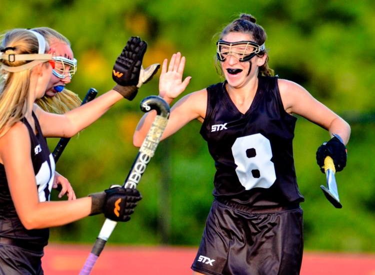 Skowhegan's Bhreagh Kennedy celebrates after scoring on a penalty stroke against Messalonskee during a game this fall in Oakland. 