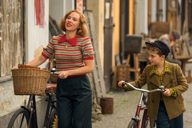 Scarlett Johansson and Roman Griffin Davis in the film "Jojo Rabbit." Photo by Larry Horricks. © 2019 Twentieth Century Fox Film Corporation All Rights Reserved