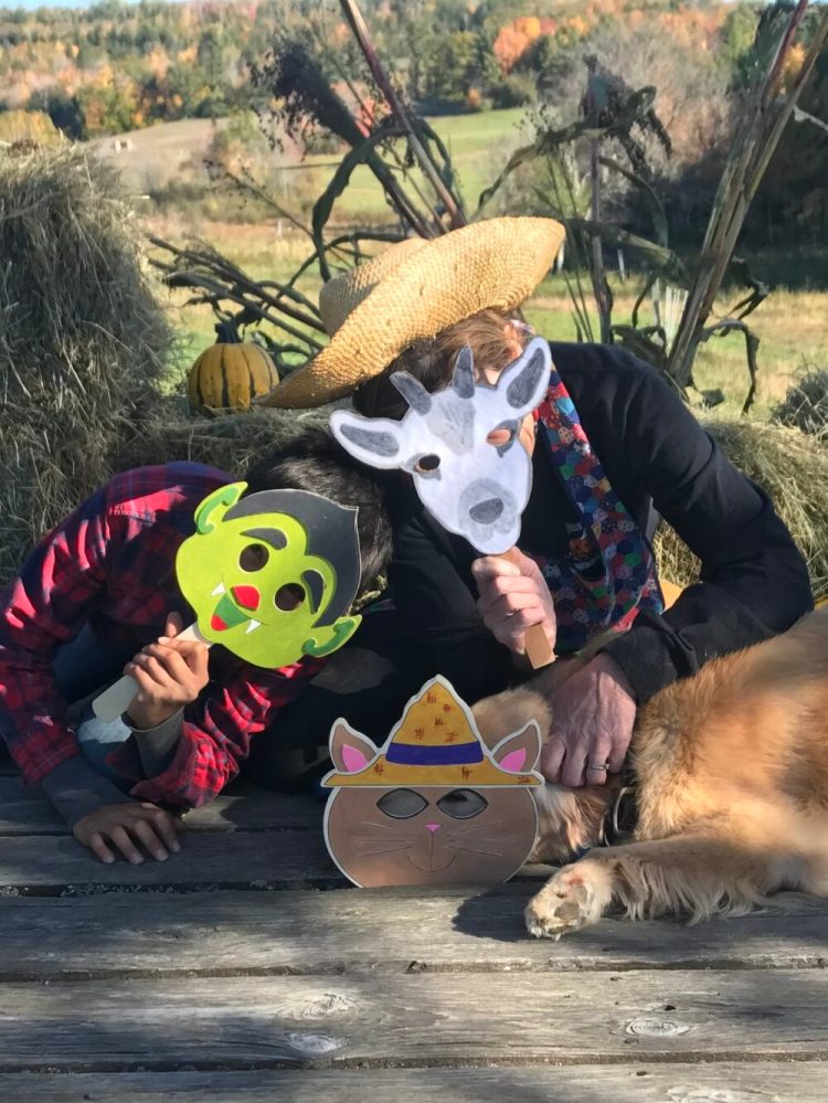 Farm friends enjoying the costume booth at Pumpkin Vine Family Farm in Somerville.  