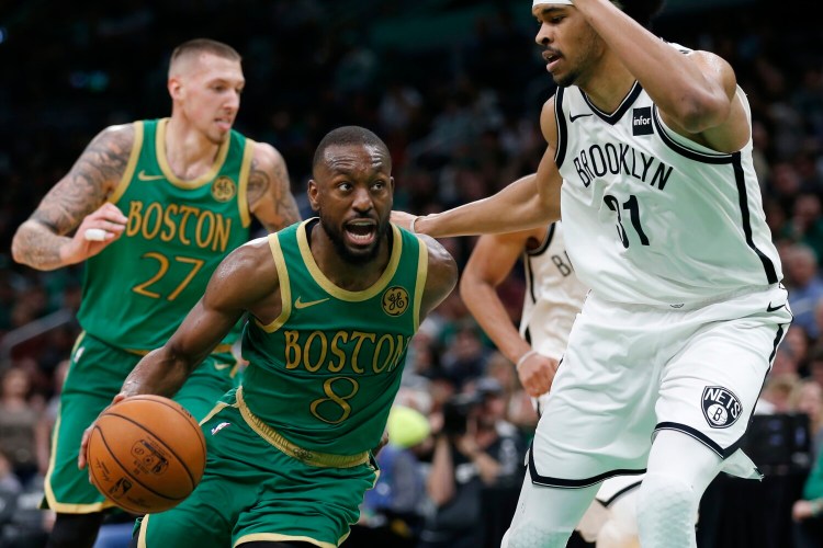 Boston's Kemba Walker, left, drives past Brooklyn's Jarrett Allen during Wednesday's game in Boston. 
