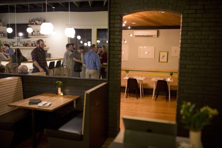 The bar area reflected in a mirror at Little Giant in 2019. The West End restaurant has been bought by a nationally known hospitality group with the highly regarded Death & Co cocktail bars in its portfolio. 