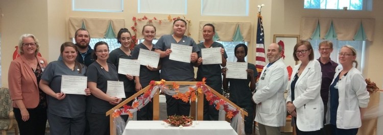 From left are Robin Doody, Northern Light Health Talent Acquisition Specialist; Chelsea Whitmore, CNA; Ryan Francis, Northern Light Continuing Care Lakewood Assistant Administrator; CNAs Katie Johnson, Aime Worcester, Karina Wright, Michaela Brown, Jessica Lewis and Shannevia Yarns; Chris Miller, NLCCL class/clinical instructor; Patricia Shuck, NLCCL Director of Nursing; Myles Robert, Western Maine Community Action employment and training specialist; and Desiree Knowles, NLCCL Assistant Director of Nursing. 