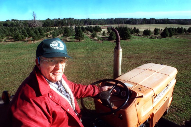 Jim Pearson of Beech Ridge Farm in Scarborough pauses while driving his tractor on Nov. 30, 1999.