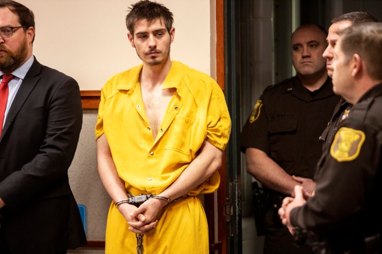 Quinton Hanna looks over at the gallery, where his family sat Thursday morning for his first appearance in Cumberland County Unified Criminal Court on a murder charge in the death of James “Jim” Pearson.