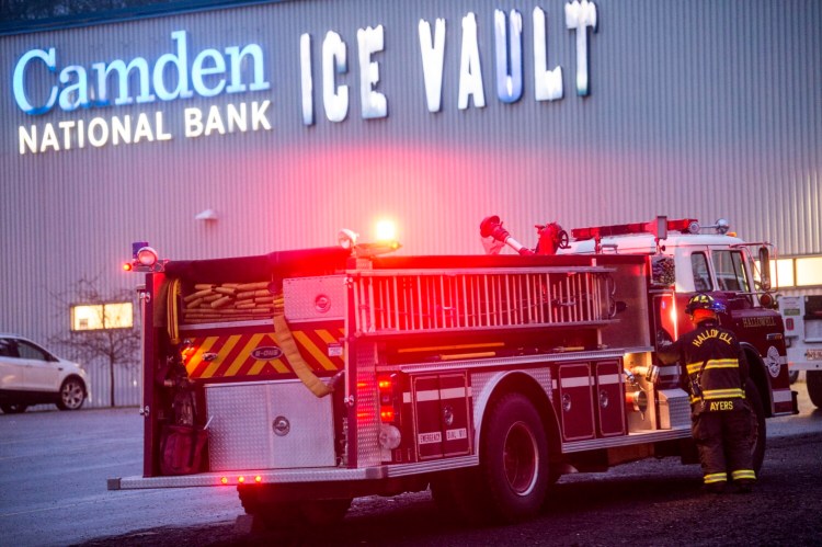 Fire department authorities evacuate the Camden National Bank Ice Vault around 4 p.m. Saturday after a gas leak was detected prior to the start of a high school hockey match. About 100 people were evacuated. 