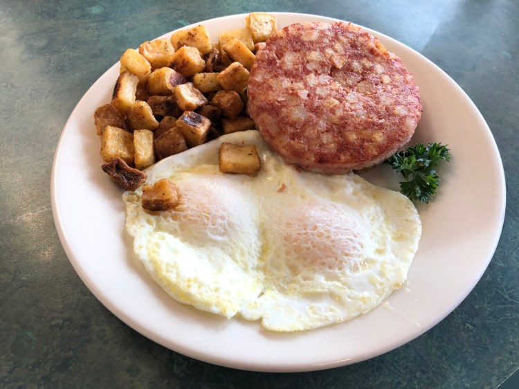 Corned beef hash with over-easy eggs and home fries at Lucky Loggers in Saco. 