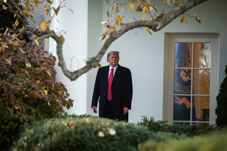 President Trump walks from the Oval Office to board Marine One on Tuesday.