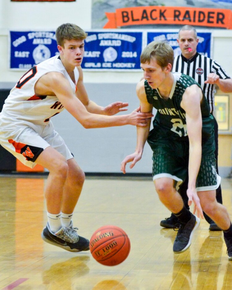 Winslow 40 Jason Reynolds, left, plays defense on Mount View 24 Sean Raven during a game on Friday January 31, 2020 at the Mansfield Gymnasium in Winslow High School. 