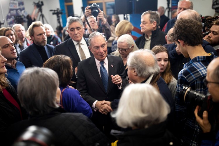 Presidential candidate Mike Bloomberg talks with supporters after speaking at his new Maine field office in Scarborough on Jan. 27.