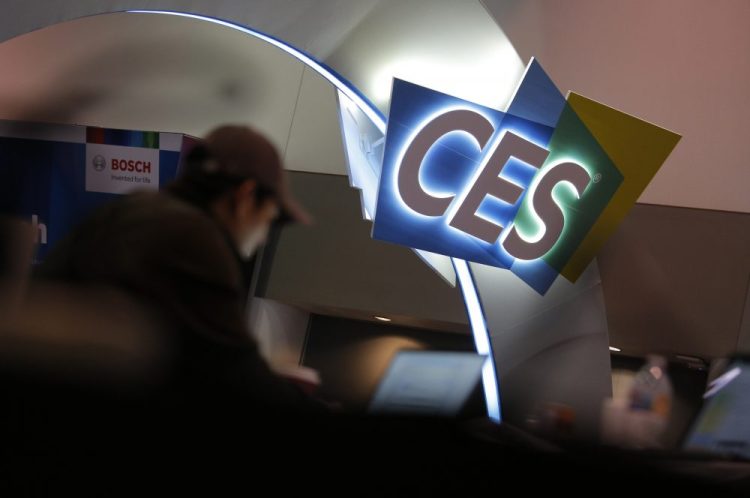 A worker helps set up a booth Saturday before CES International in Las Vegas.