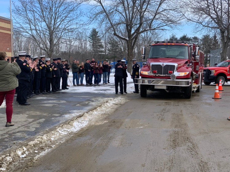 Longtime Oakland Deputy Fire Chief Hardy Taylor is greeted by local firefighters and community members Saturday during his retirement celebration.