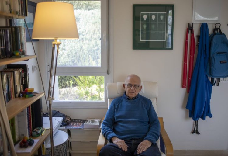 Holocaust survivor Maurice Gluck poses for a photo in his home in Ya'ad, northern Israel. Shortly before they were rounded up by Nazi troops in Belgium and deported to Auschwitz in 1942, the parents of three-year-old Maurice Gluck placed their only child in the care of a local Christian family. Gluck forgot his Yiddish mother tongue and that he even had parents of his own. 