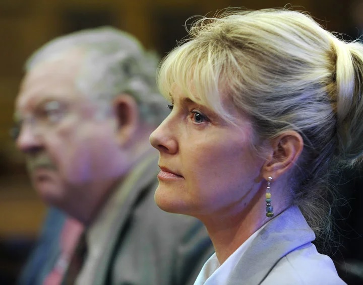 Linda Dolloff listens in court on May 11, 2010, as the jury pronounces her guilty of attempted murder for assaulting her husband, Jeffrey Dolloff, with a softball bat. Next to her is Daniel Lilly, her attorney. 