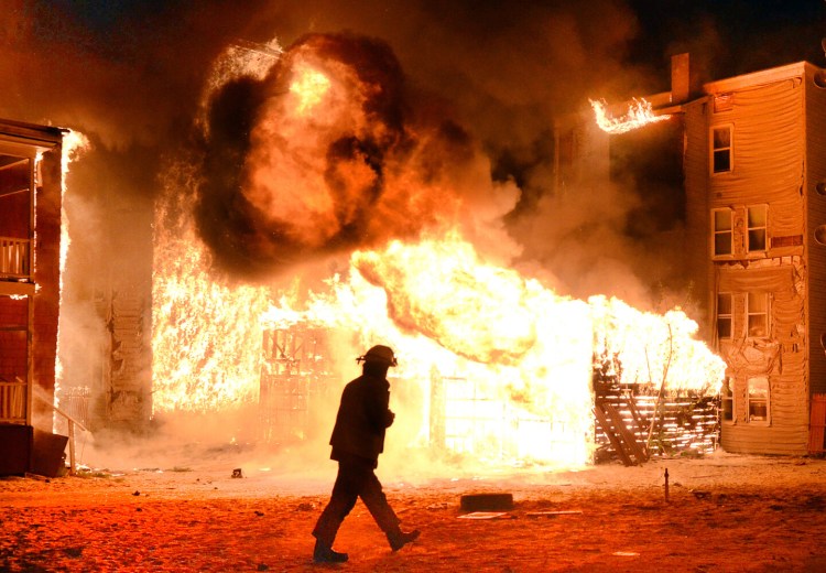 Lewiston fire Capt. Richard Cailler is first on scene at a  fire on Pierce and Bartlett streets in Lewiston on May 3, 2013.


