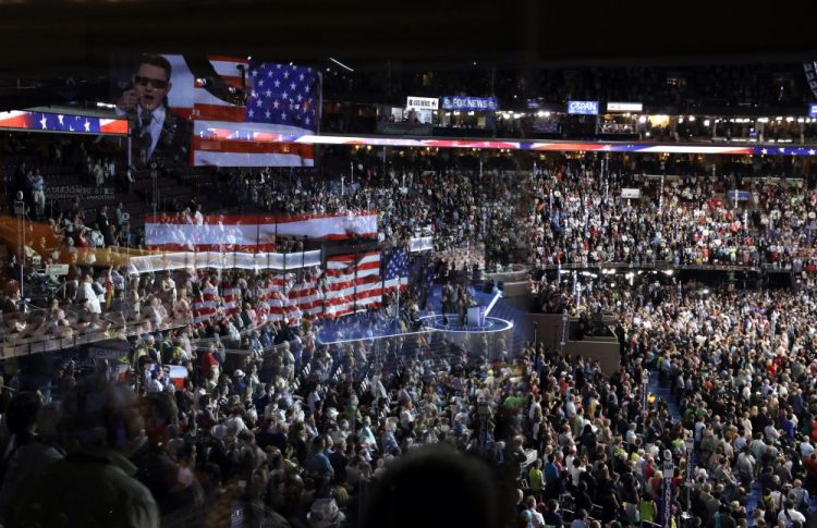 The stage is reflected on a glass window at Wells Fargo Arena  durikng the Democratic National Convention in Philadelphia in July 2016. Democrats are delaying their nominating convention this year until August, they announced Thursday.