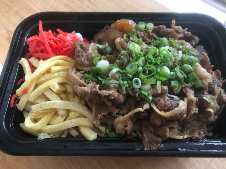 A gyudon rice bowl, with simmered beef and onions, kinshi tamago, ginger and scallions from Pai Men Miyake in Portland. 