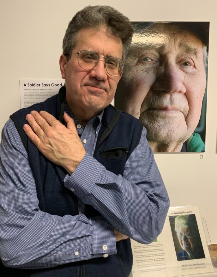 Rich Abrahamson with his exhibit "A Soldier Says Goodbye." 