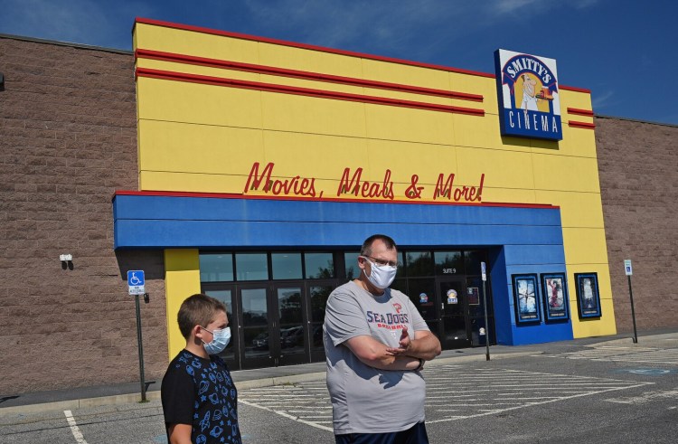 Greg Lee of Yarmouth, with son Timmy at Smitty's Cinema in Topsham: "It’s good to have something that feels almost normal, or like the new normal."