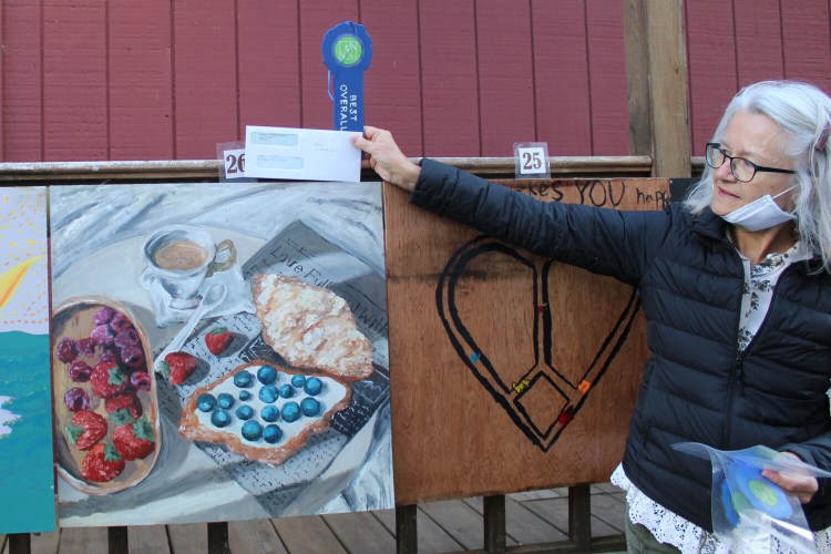 Sophie Chu-O’Neil won the vote in “Best Overall.” RFA President Val Zapolsky not shown is holding Chu-O’Neil’s ribbon above her winning submission. 