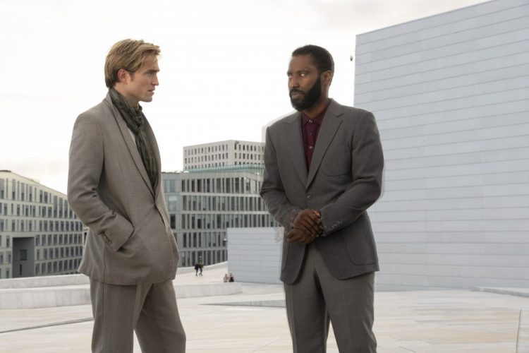 Robert Pattinson, left, and John David Washington in a scene from "Tenet."  