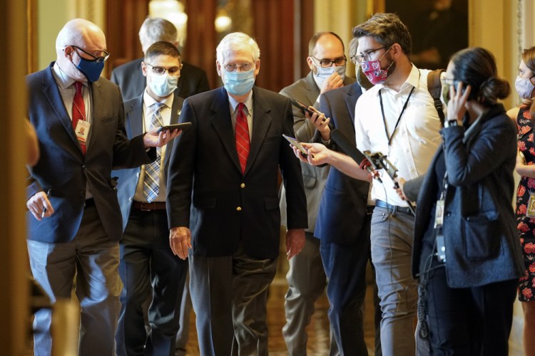 Senate Majority Leader Mitch McConnell of Kentucky talks with reporters after he spoke on the Senate floor on Monday at the Capitol in Washington. 