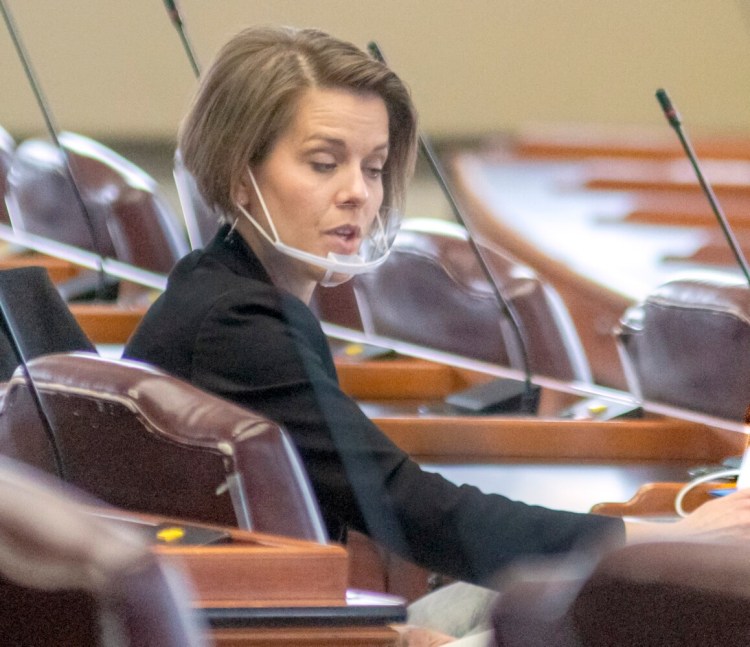 Rep. Laurel Libby, R-Auburn, attends a virtual meeting of the Judiciary Committee from her desk in the House of Representatives on Thursday. The state CDC says the chin-shield type mask she wore is not effective in preventing the spread of the coronavirus.