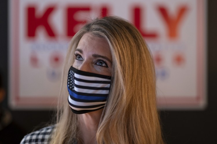 U.S. Sen. Kelly Loeffler, R-Ga., talks to supporters during a campaign event Friday at McCray's Tavern in Marietta, Ga.