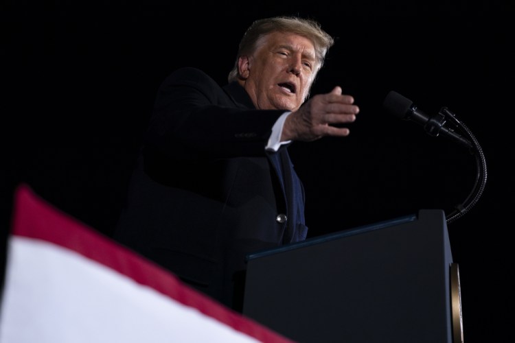 President Donald Trump speaks during a campaign rally for Sen. Kelly Loeffler, R-Ga., and David Perdue, at Dalton Regional Airport, Monday, Jan. 4, in Dalton, Ga. 